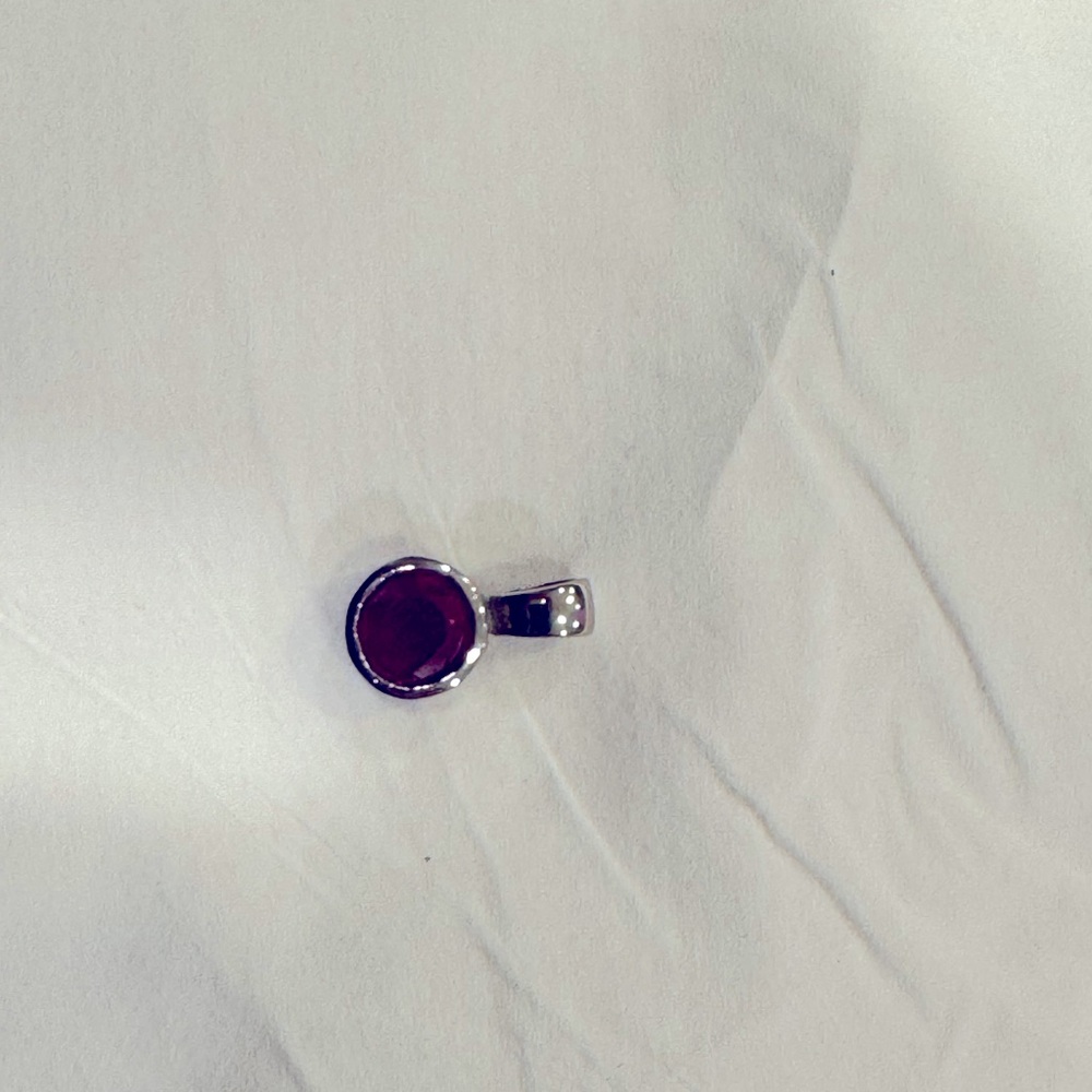 Ruby solitaire pendant. Approximate weight - 1/2 carat.